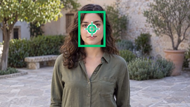 The same portrait with a detected face bounding box and the focal point centered on the face